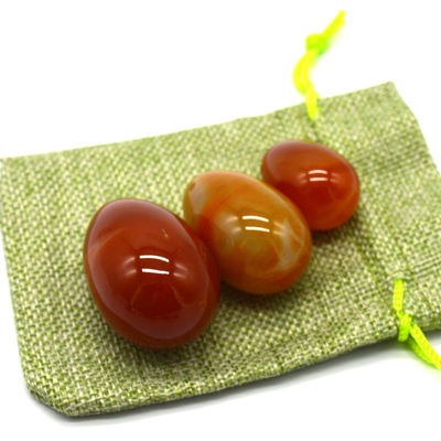 OEM ODM Accepted Red Carnelian Yoni Eggs Semi Precious Stone Eggs Drilled Massage Style
