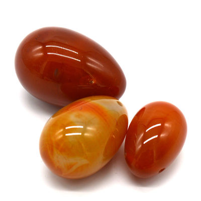 OEM ODM Accepted Red Carnelian Yoni Eggs Semi Precious Stone Eggs Drilled Massage Style