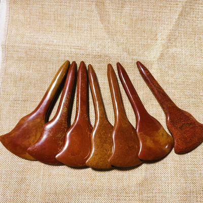 Experience the Healing Benefits of Full-body Massage and Acupoint Stimulation with Red Bian Stone Gua Sha Board
